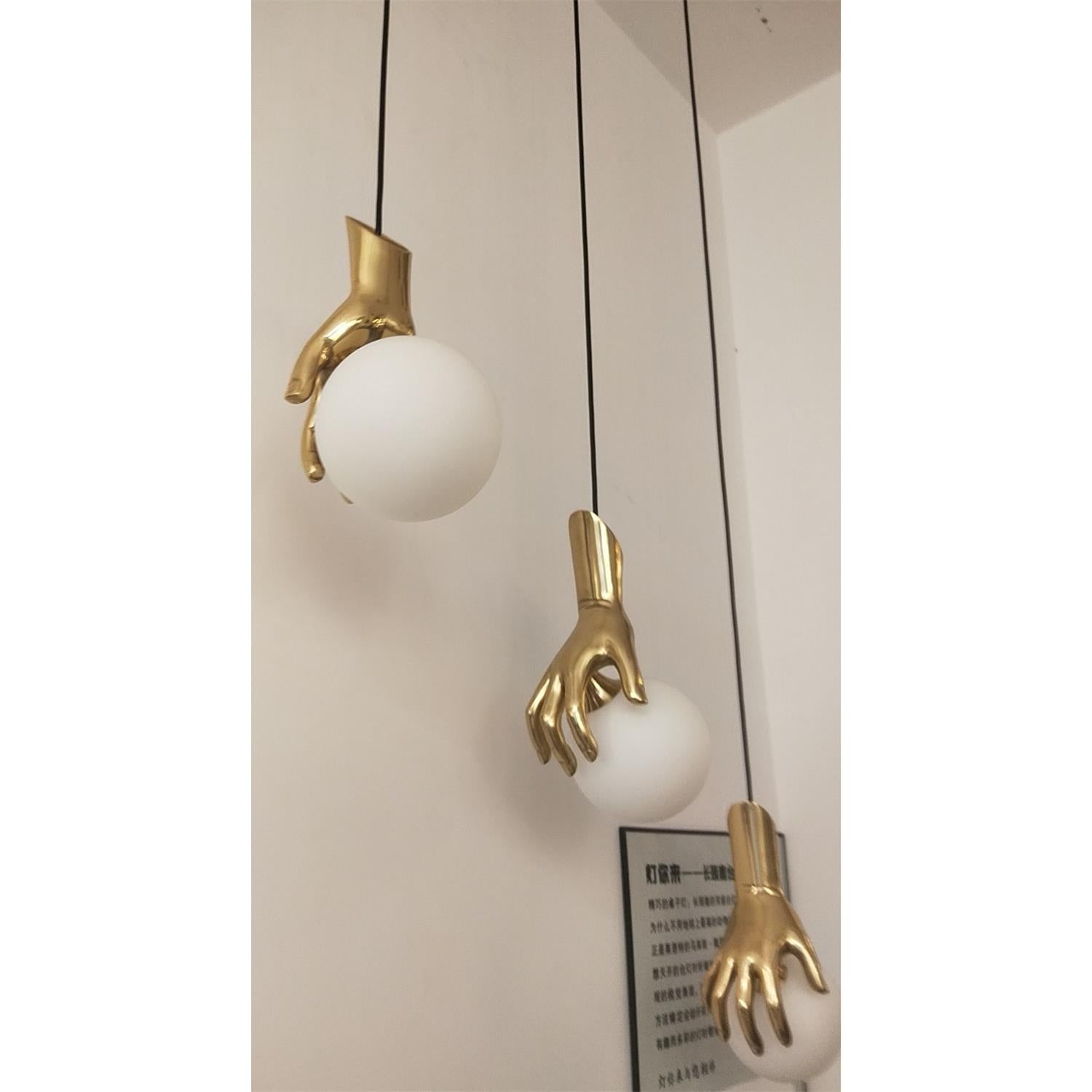 Avnorira Hand Holding Globe Brass Glass Pendant Light - Letslighting