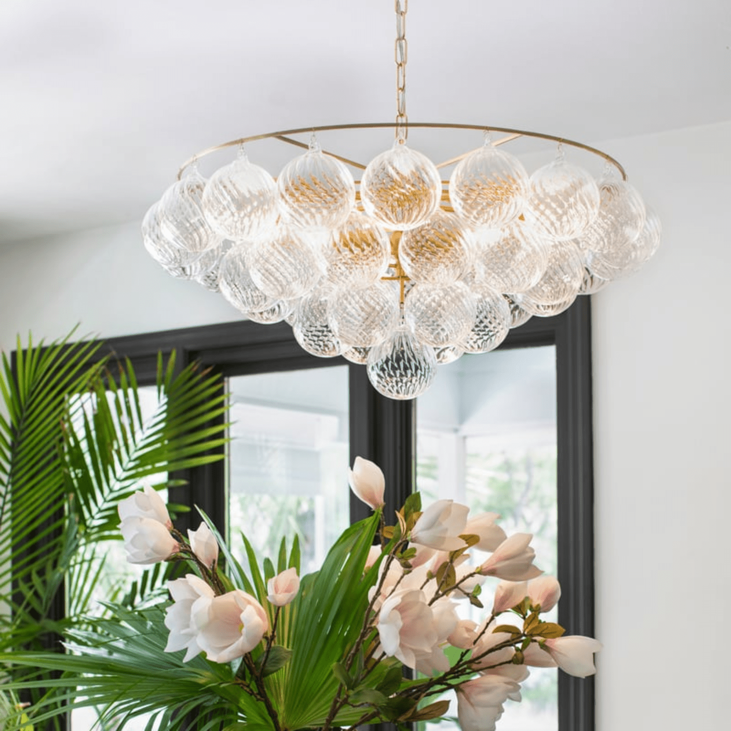 Aurora Chandelier Clear Glass Globe Aged Brass Elegant