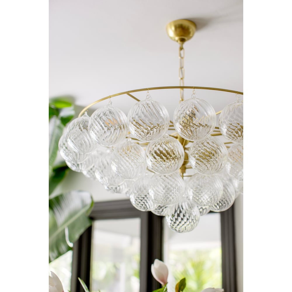 Aurora Chandelier Clear Glass Globe Aged Brass Elegant