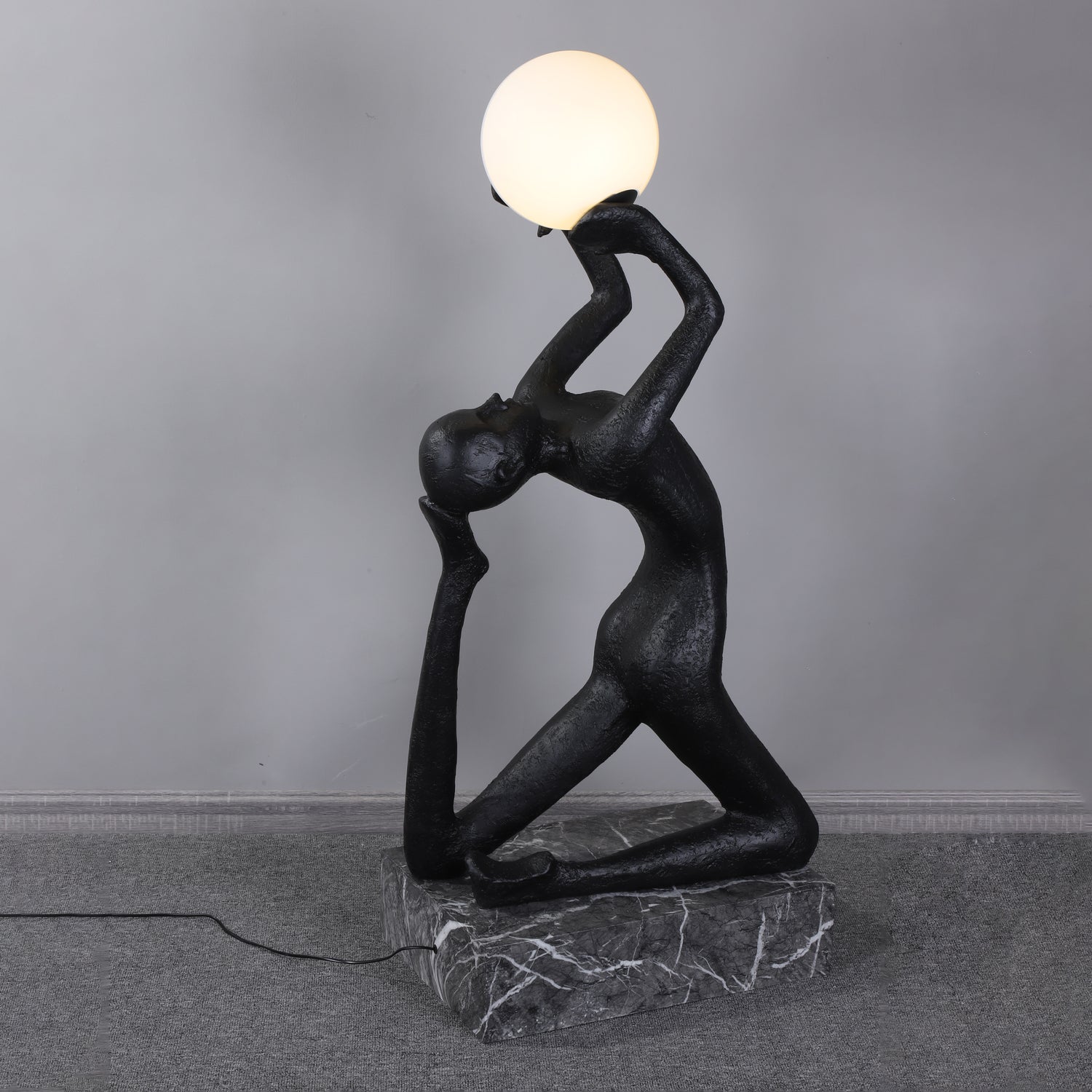 Evvinyra Contorted Black Metal Floor Lamp - Blowlighting