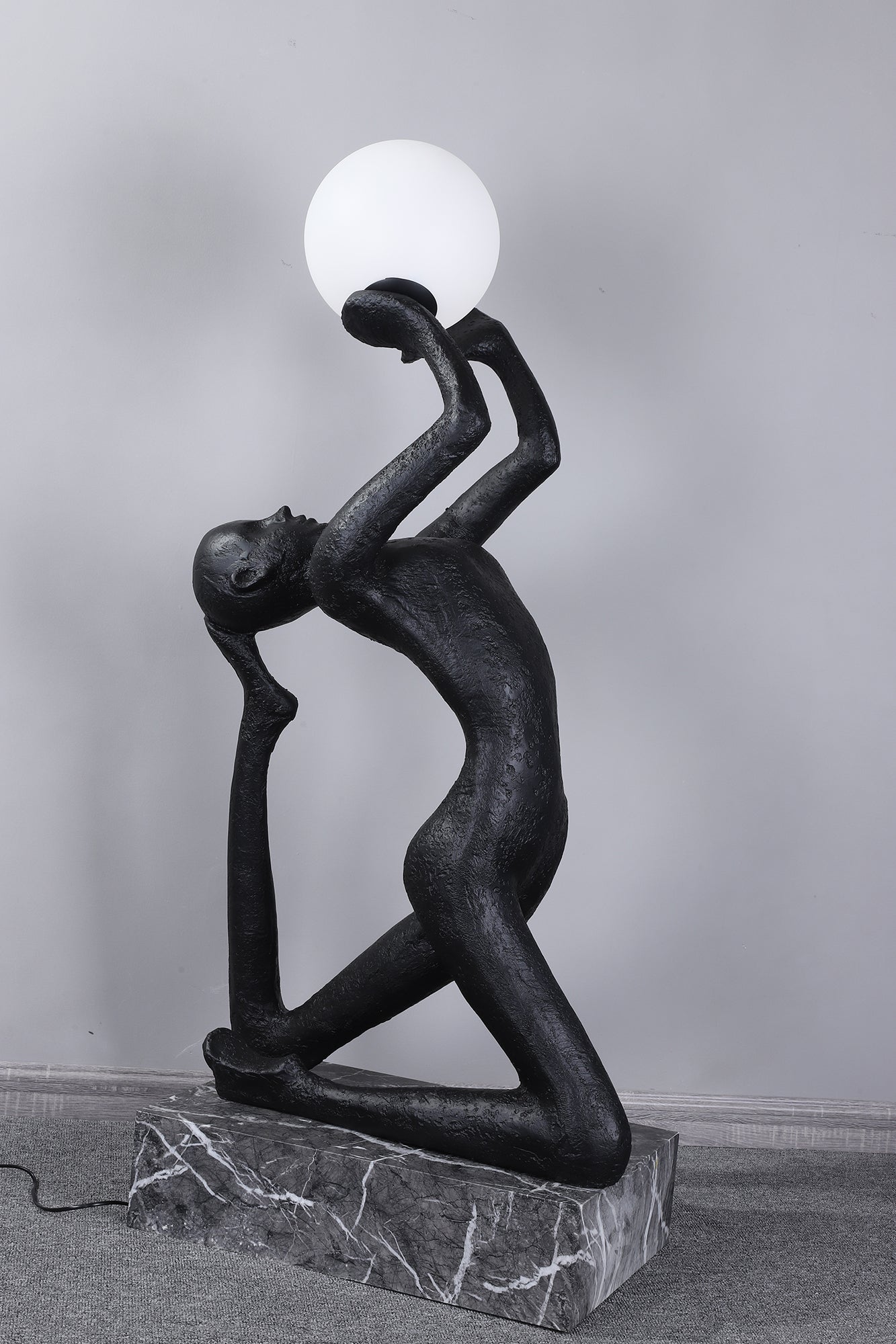 Evvinyra Contorted Black Metal Floor Lamp - Blowlighting