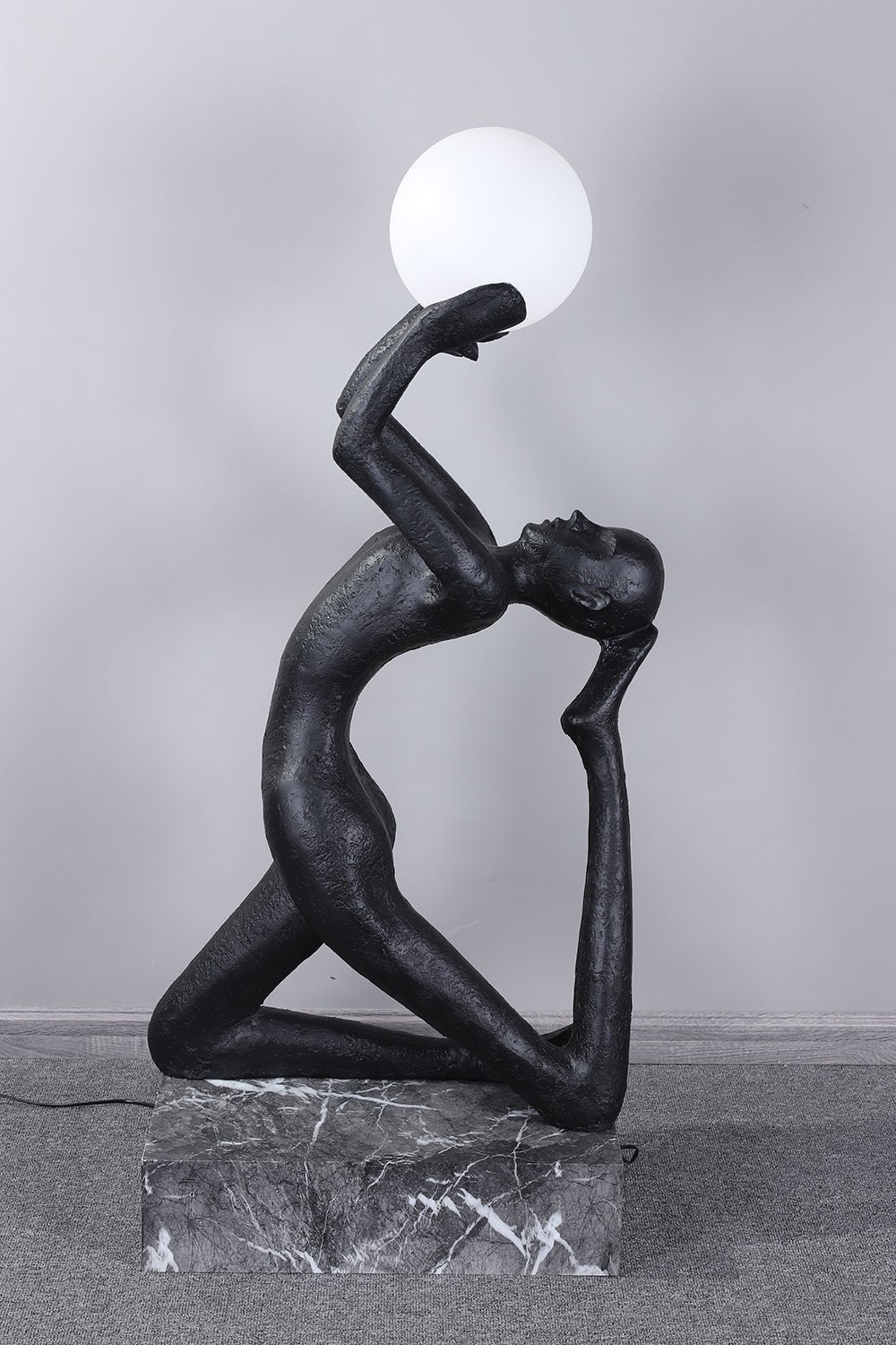 Evvinyra Contorted Black Metal Floor Lamp - Blowlighting
