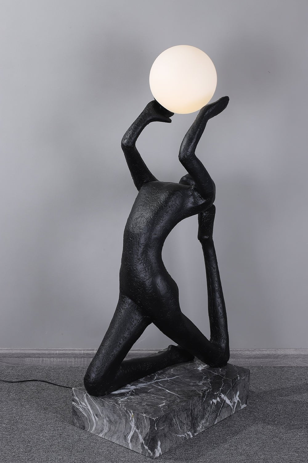 Evvinyra Contorted Black Metal Floor Lamp - Blowlighting