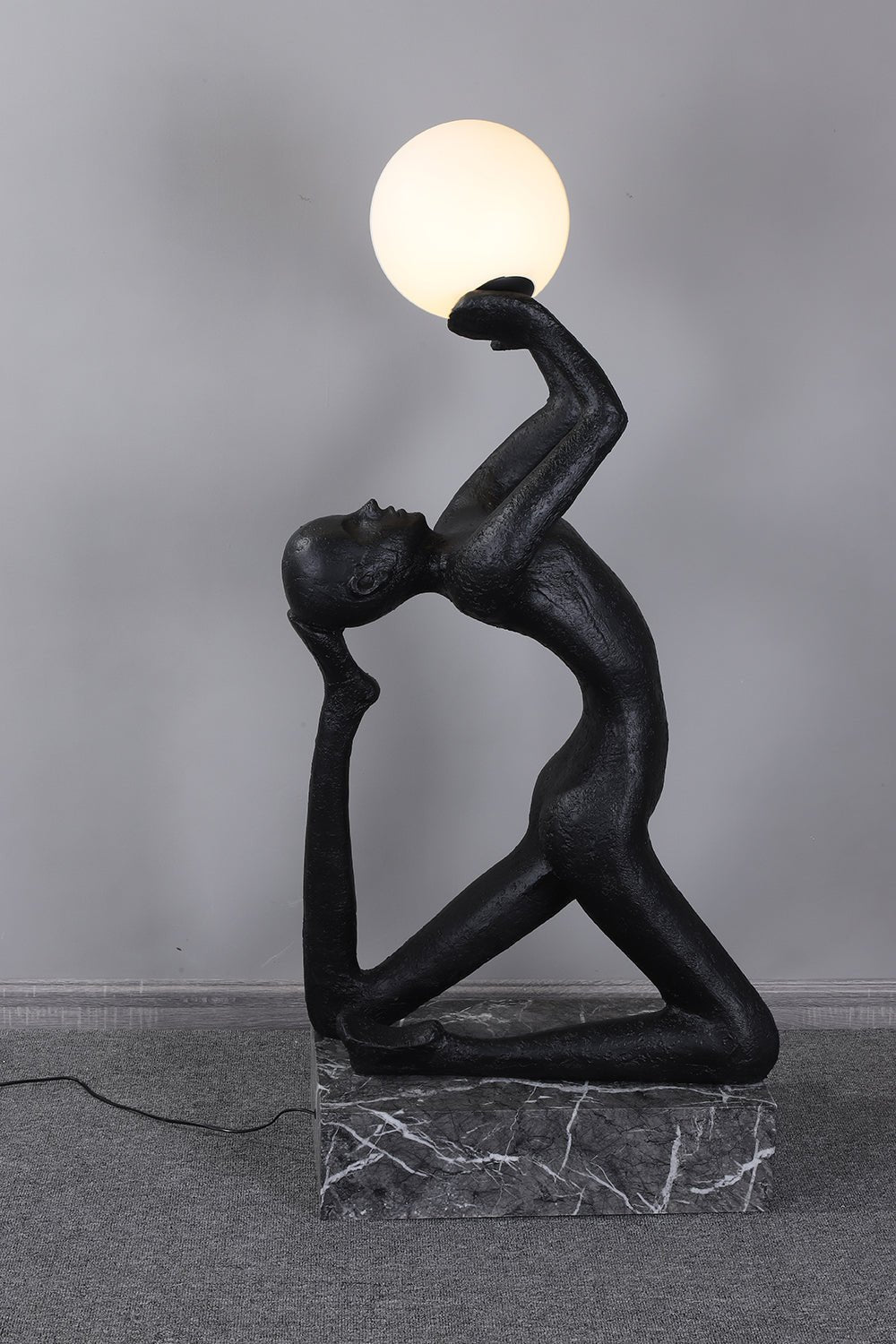 Evvinyra Contorted Black Metal Floor Lamp - Blowlighting
